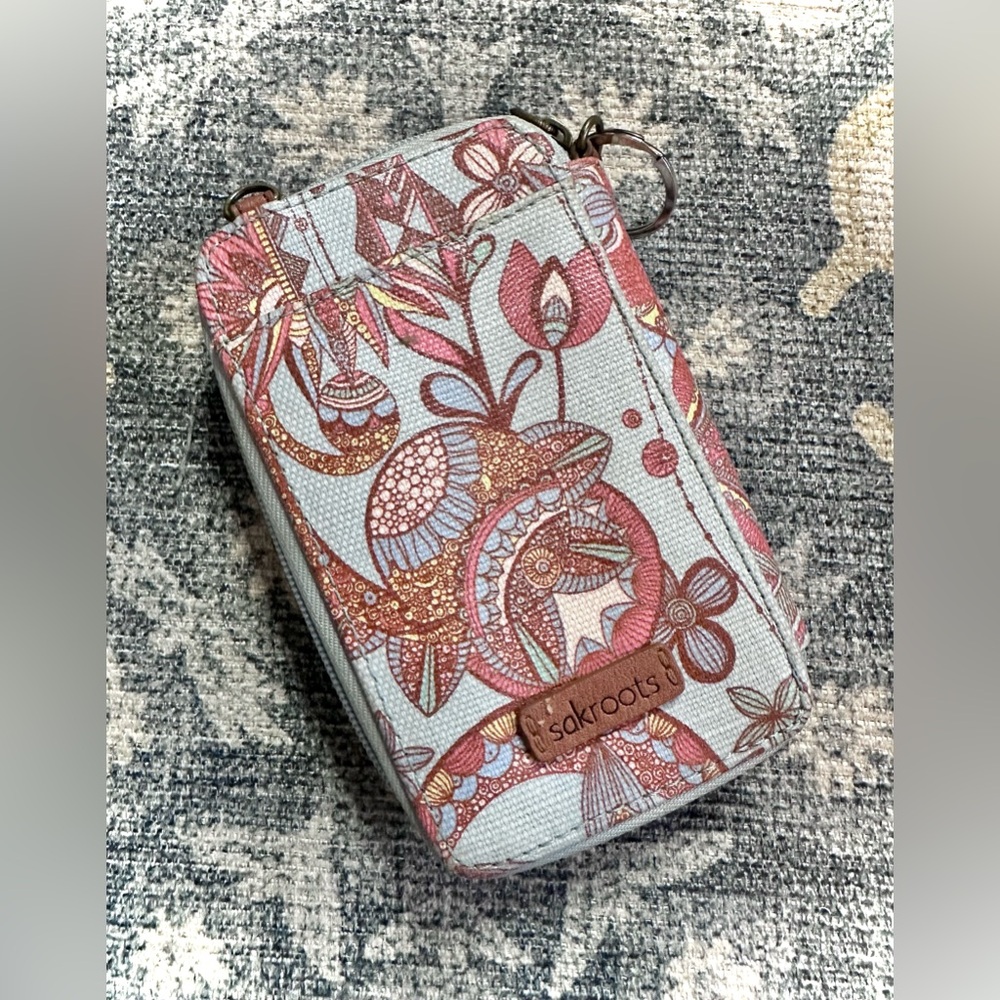 Sakroots wristlet wallet in a sky spirit desert print
